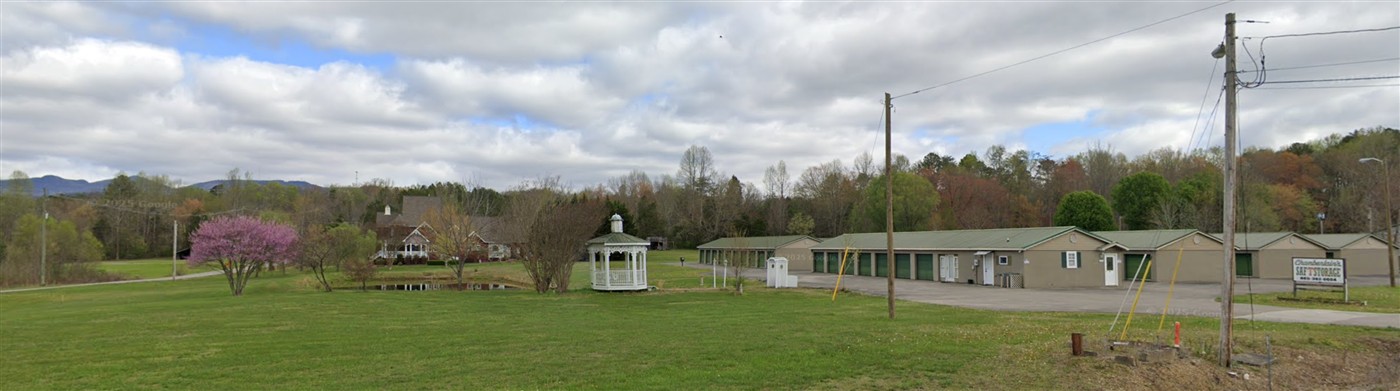 Wide view of the grounds, gazebo and storage buildings